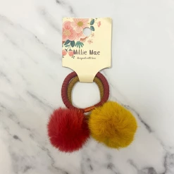 Mooch..... Set Of Two Hair Elastics With Faux Fur Pom Poms - Rust/Ochre